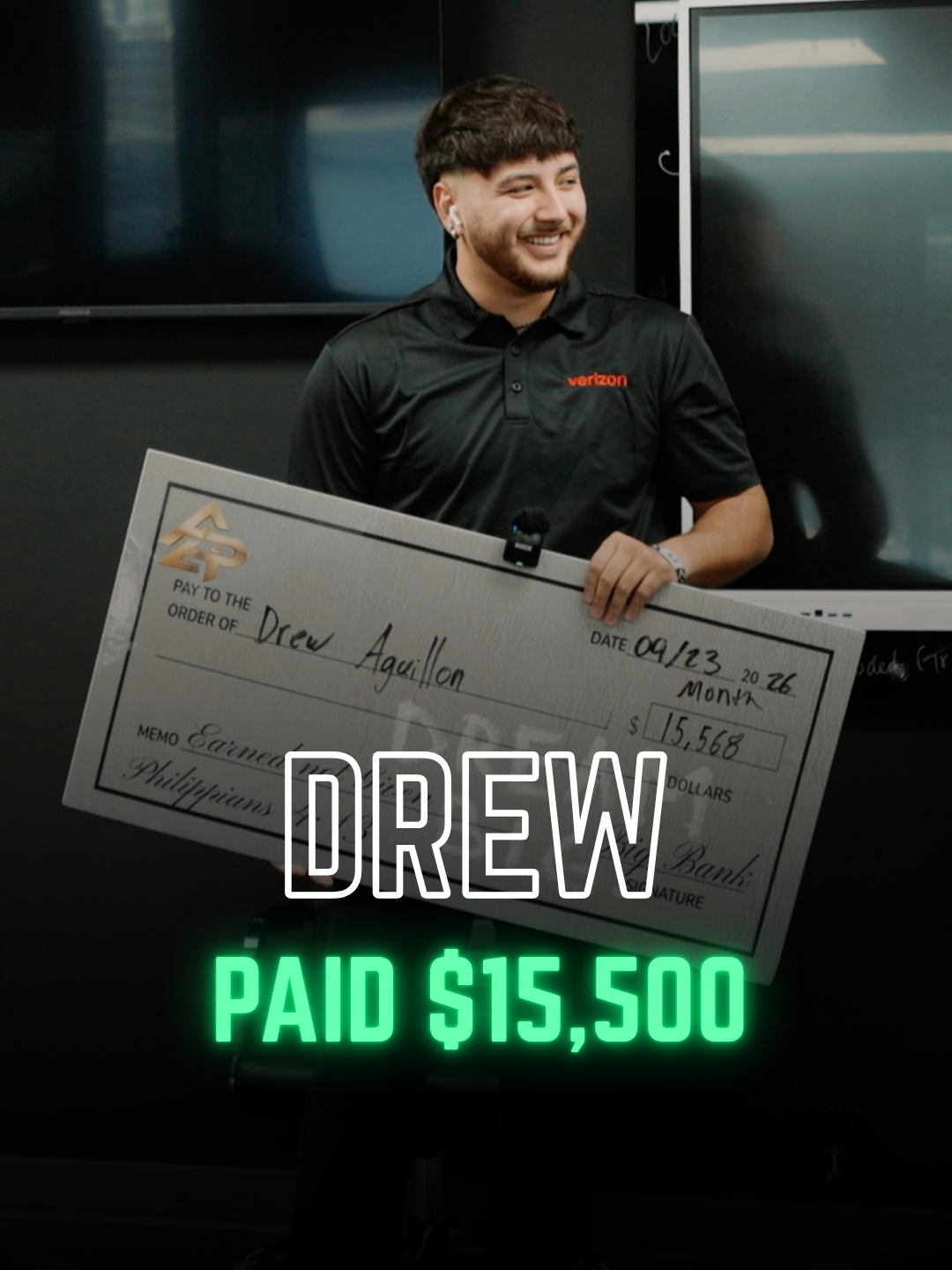 Apex Division rep with a big check