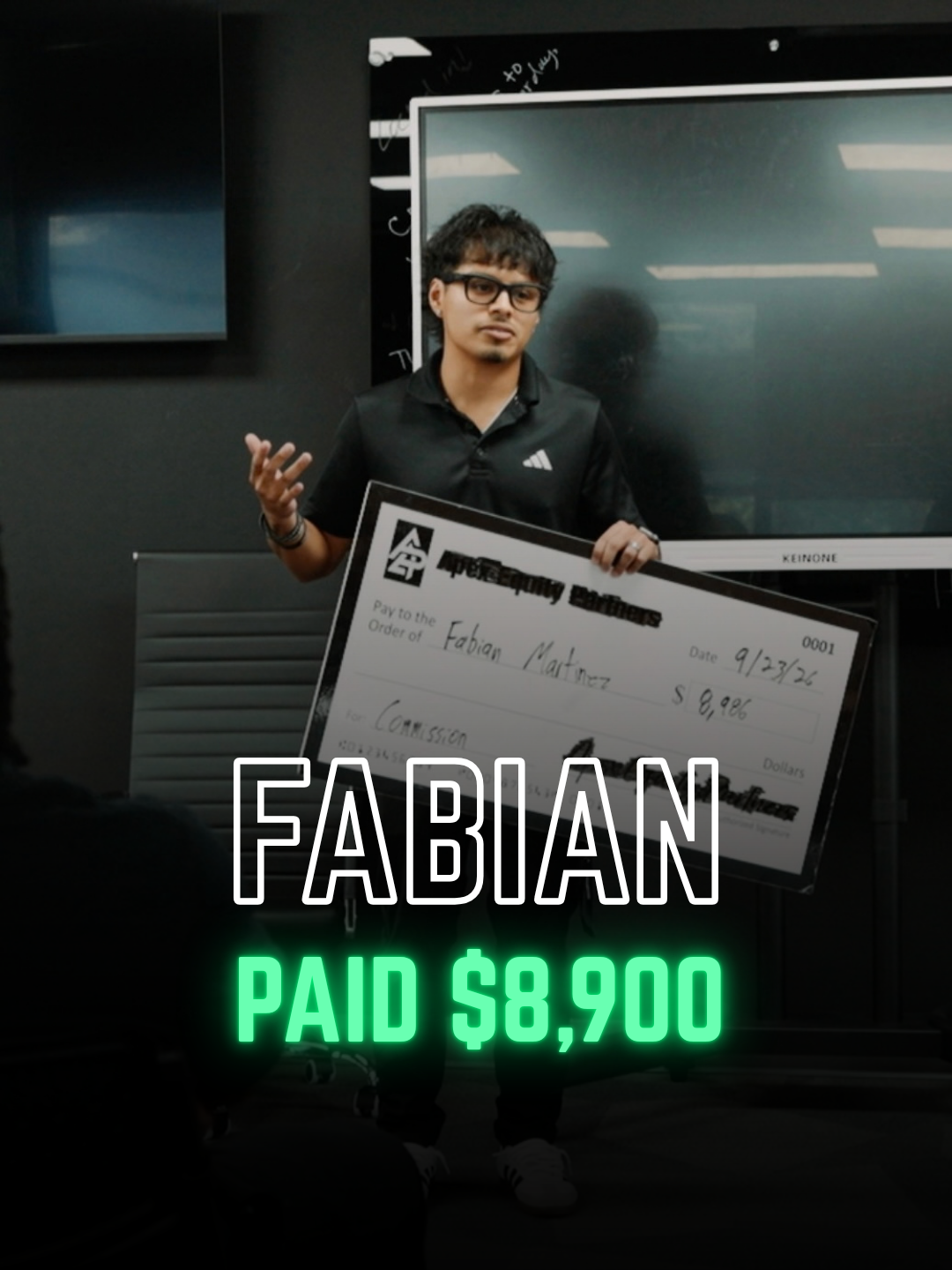 Apex Division rep with a big check