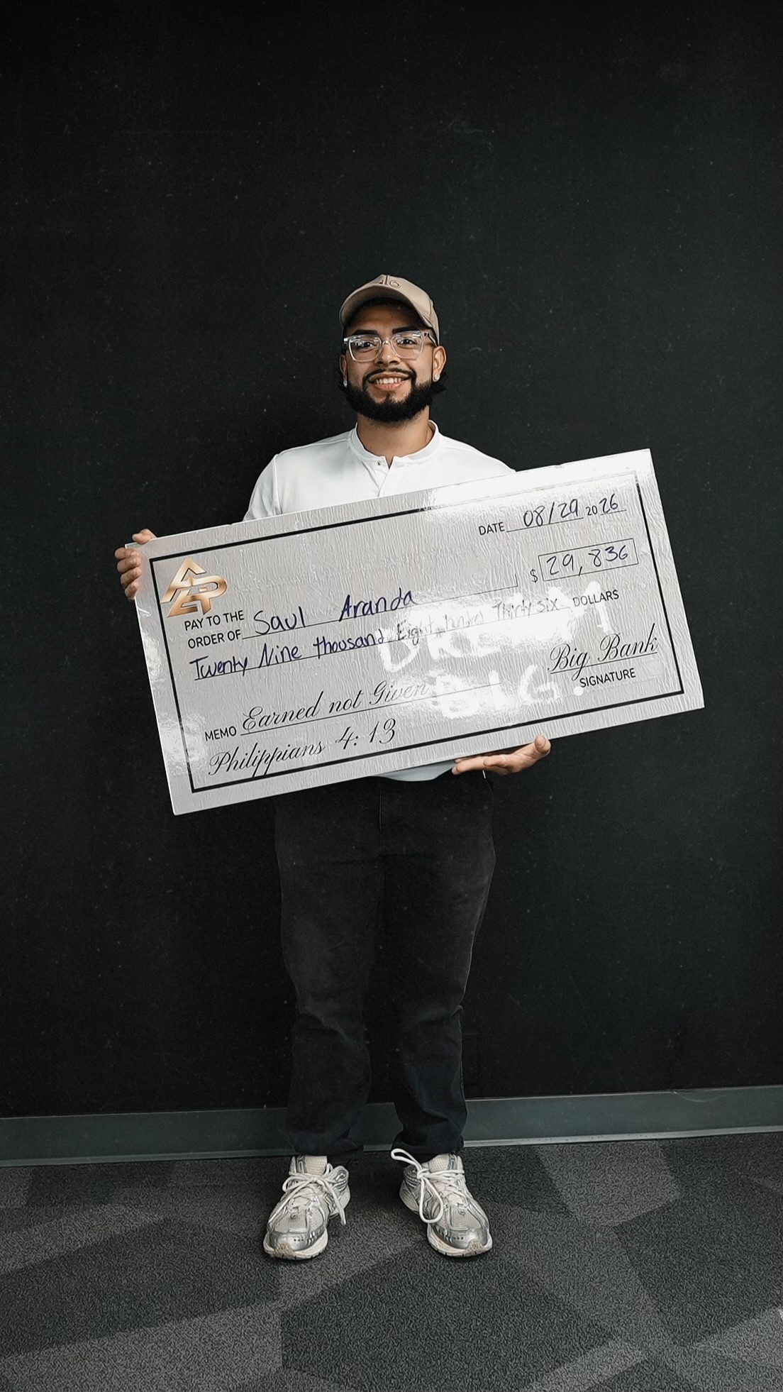 Apex Division rep with a big check